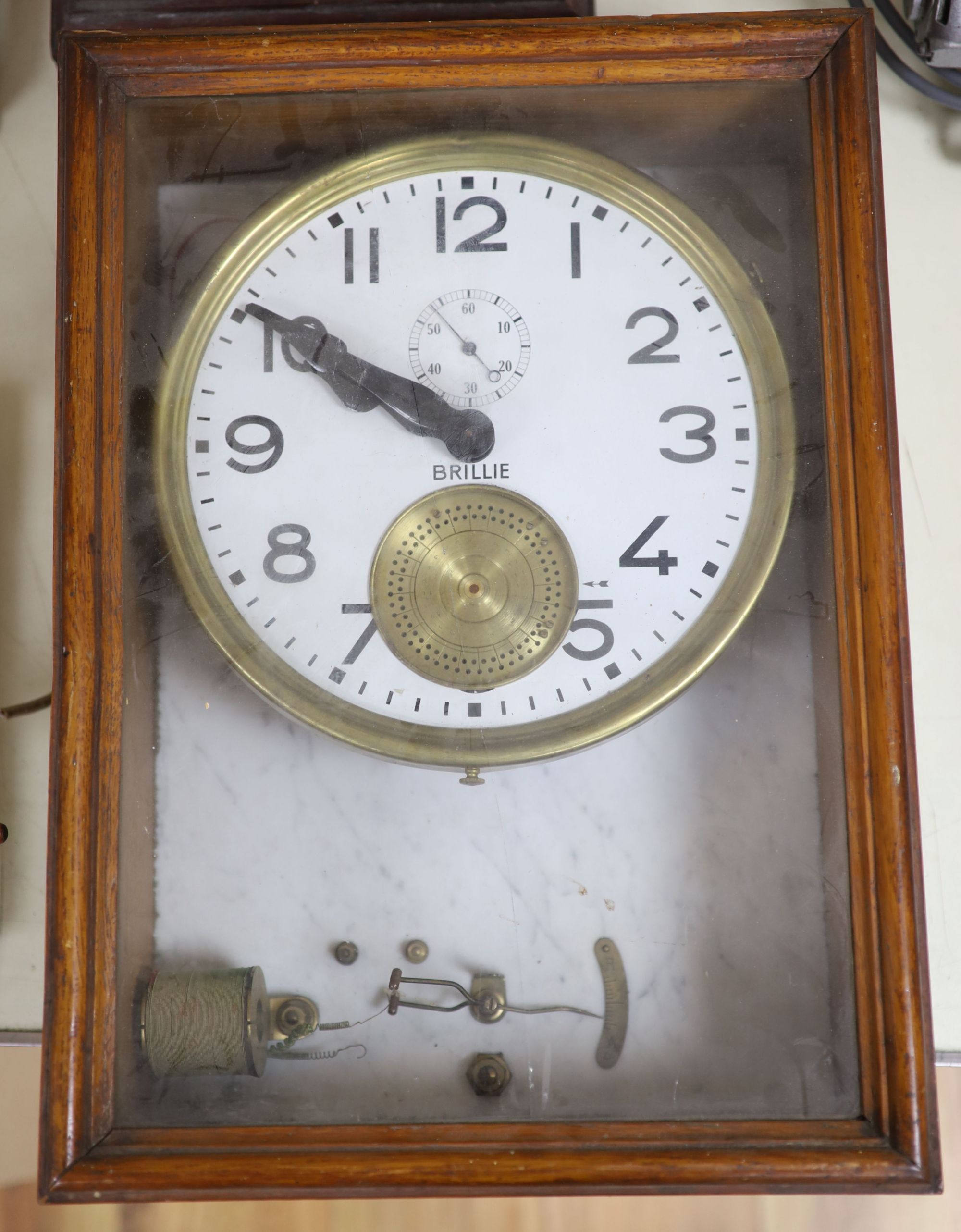 A Brillie walnut, marble and brass electric wall clock, 46cm